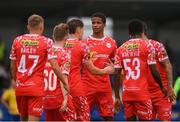 19 July 2025; Raymond Offor, centre, and Shelbourne  team-mates congratulate John Martin, third from left, after scoring their side's fourth goal during the Sports Direct Men’s FAI Cup second round match between Fairview Rangers and Shelbourne at Singland Park in Limerick. Photo by Stephen McCarthy/Sportsfile
