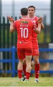 19 July 2025; Sean Boyd, right, congratulates his Shelbourne team-mate John Martin, 10, on scoring their third goal during the Sports Direct Men’s FAI Cup second round match between Fairview Rangers and Shelbourne at Singland Park in Limerick. Photo by Stephen McCarthy/Sportsfile