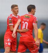 19 July 2025; John Martin of Shelbourne is congratulated by James Bailey, left, after scoring their side's fourth goal during the Sports Direct Men’s FAI Cup second round match between Fairview Rangers and Shelbourne at Singland Park in Limerick. Photo by Stephen McCarthy/Sportsfile