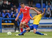 19 July 2025; Dan Ring of Shelbourne is tackled by Oleg Vysochan of Fairview Rangers during the Sports Direct Men’s FAI Cup second round match between Fairview Rangers and Shelbourne at Singland Park in Limerick. Photo by Stephen McCarthy/Sportsfile