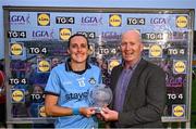 19 July 2025; Hannah Tyrrell of Dublin receives the Player of the Match award from TG4 Head of Sport, Rónán Ó Coisdealbha, after the TG4 All-Ireland Ladies Football Senior Championship semi-final match between Dublin and Galway at Glenisk O’Connor Park in Tullamore, Offaly. Photo by Piaras Ó Mídheach/Sportsfile