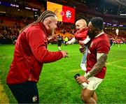 19 July 2025; Finlay Bealham of British & Irish Lions, left, with his son Joaquin and teammate Bundee Aki after the first test match between Australia and the British & Irish Lions at Suncorp Stadium in Brisbane, Australia. Photo by Brendan Moran/Sportsfile