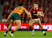 19 July 2025; Sione Tuipulotu of British & Irish Lions in action against Joseph-Aukuso Suaalii of Australia during the first test match between Australia and the British & Irish Lions at Suncorp Stadium in Brisbane, Australia. Photo by Brendan Moran/Sportsfile