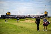 20 July 2025; Shane Lowry of Ireland and his caddie Darren Reynolds walk down the 18th fairway during the final round of The 153rd Open Championship at Royal Portrush Golf Club in Portrush, Antrim. Photo by Ramsey Cardy/Sportsfile