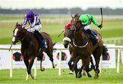 20 July 2025; Diego Velazquez, with Ryan Moore up, left, on their way to winning the Romanised Minstrel Stakes from second place East Hampton, with Luke McAteer up, during day two of the Juddmonte Irish Oaks Weekend at The Curragh Racecourse in Kildare. Photo by Matt Browne/Sportsfile