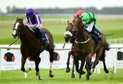 20 July 2025; Diego Velazquez, left, with Ryan Moore up, on their way to winning the Romanised Minstrel Stakes from second place East Hampton with Luke McAteer during day two of the Juddmonte Irish Oaks Weekend at The Curragh Racecourse in Kildare. Photo by Matt Browne/Sportsfile