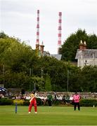 20 July 2025; Lindokuhle Mahbera of Zimbabwe bats, as the Poolbeg Stacks are seen, during match one of the Women's T20 International Series between Ireland and Zimbabwe at Pembroke Cricket Club in Dublin. Photo by Ben McShane/Sportsfile