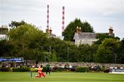 20 July 2025; Chipo Spiwe Tiripano of Zimbabwe bats, as the Poolbeg Stacks are seen, during match one of the Women's T20 International Series between Ireland and Zimbabwe at Pembroke Cricket Club in Dublin. Photo by Ben McShane/Sportsfile