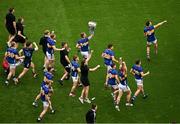 20 July 2025; Tipperary players including John McGrath, 14, run toward Hill 16 with the Liam MacCarthy Cup after their side's victory in the GAA Hurling All-Ireland Senior Championship final match between Cork and Tipperary at Croke Park in Dublin. Photo by David Fitzgerald/Sportsfile