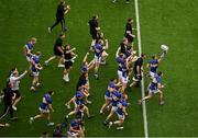 20 July 2025; Tipperary players including John McGrath, 14, run toward Hill 16 with the Liam MacCarthy Cup after their side's victory in the GAA Hurling All-Ireland Senior Championship final match between Cork and Tipperary at Croke Park in Dublin. Photo by David Fitzgerald/Sportsfile