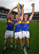 20 July 2025; Tipperary players, from left, Brian McGrath, Noel McGrath and John McGrath with the Liam MacCarthy Cup after their side's victory in the GAA Hurling All-Ireland Senior Championship final match between Cork and Tipperary at Croke Park in Dublin. Photo by Stephen McCarthy/Sportsfile