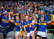 20 July 2025; Tipperary players and brothers, from left, Brian McGrath, Noel McGrath and John McGrath celebrate with family and the Liam MacCarthy Cup after their side's victory in the GAA Hurling All-Ireland Senior Championship final match between Cork and Tipperary at Croke Park in Dublin. Photo by Stephen McCarthy/Sportsfile