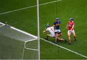 20 July 2025; John McGrath of Tipperary scores his side's third goal despite the efforts of Cork players, from left, Patrick Collins and Seán O'Donoghue during the GAA Hurling All-Ireland Senior Championship final match between Cork and Tipperary at Croke Park in Dublin. Photo by John Sheridan/Sportsfile