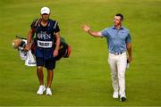 20 July 2025; Rory McIlroy of Northern Ireland, alongside his caddie Harry Diamiond, acknowledges supporters as he walks down the 18th fairway during the final round of The 153rd Open Championship at Royal Portrush Golf Club in Portrush, Antrim. Photo by Ramsey Cardy/Sportsfile