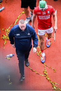 20 July 2025; Cork manager Pat Ryan looks up at the Tipperary players lifting the Liam MacCarthy cup as he leaves field after the GAA Hurling All-Ireland Senior Championship final match between Cork and Tipperary at Croke Park in Dublin. Photo by Daire Brennan/Sportsfile