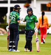 20 July 2025; Gaby Lewis, left, and Lara Paul of Ireland during match one of the Women's T20 International Series between Ireland and Zimbabwe at Pembroke Cricket Club in Dublin. Photo by Ben McShane/Sportsfile