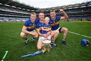 20 July 2025; Tipperary brothers, from left, Brian McGrath, Noel McGrath, and his son Sam, and John McGrath celebrate with the Liam MacCarthy cup after their side's victory in the GAA Hurling All-Ireland Senior Championship final match between Cork and Tipperary at Croke Park in Dublin. Photo by Stephen McCarthy/Sportsfile
