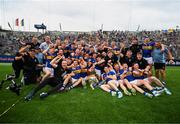 20 July 2025; Tipperary players and staff celebrate with the Liam MacCarthy cup after their side's victory in the GAA Hurling All-Ireland Senior Championship final match between Cork and Tipperary at Croke Park in Dublin. Photo by Stephen McCarthy/Sportsfile