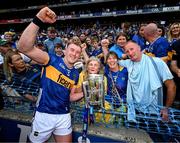 20 July 2025; Eoghan Connolly of Tipperary and family, from left, grandmother Anne, mother Teresa and father TJ celebrate with the Liam MacCarthy cup after their side's victory in the GAA Hurling All-Ireland Senior Championship final match between Cork and Tipperary at Croke Park in Dublin. Photo by Stephen McCarthy/Sportsfile