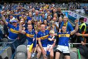 20 July 2025; Tipperary brothers, from left, Brian McGrath, Noel McGrath and John McGrath celebrate with the Liam MacCarthy cup and family after their side's victory in the GAA Hurling All-Ireland Senior Championship final match between Cork and Tipperary at Croke Park in Dublin. Photo by Stephen McCarthy/Sportsfile