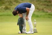 20 July 2025; Scottie Scheffler of USA, with his son Bennett, celebrates with the Claret Jug after winning The 153rd Open Championship at Royal Portrush Golf Club in Portrush, Antrim. Photo by Ramsey Cardy/Sportsfile
