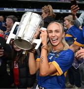 20 July 2025; Irish Olympian, Sharlene Mawdsley, partner of Tipperary's Michael Breen, celebrates with the Liam MacCarthy cup after the GAA Hurling All-Ireland Senior Championship final match between Cork and Tipperary at Croke Park in Dublin. Photo by Stephen McCarthy/Sportsfile