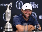 20 July 2025; Scottie Scheffler of USA speaks in a press conference alongside the Claret Jug iafter winning The 153rd Open Championship at Royal Portrush Golf Club in Portrush, Antrim. Photo by Ramsey Cardy/Sportsfile