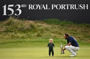 20 July 2025; Scottie Scheffler of USA and his son Bennett celebrate with the Claret Jug after winning The 153rd Open Championship at Royal Portrush Golf Club in Portrush, Antrim. Photo by Ramsey Cardy/Sportsfile