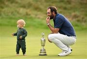 20 July 2025; Scottie Scheffler of USA, with his son Bennett, celebrates with the Claret Jug after winning The 153rd Open Championship at Royal Portrush Golf Club in Portrush, Antrim. Photo by Ramsey Cardy/Sportsfile