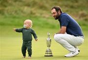 20 July 2025; Scottie Scheffler of USA, with his son Bennett, celebrates with the Claret Jug after winning The 153rd Open Championship at Royal Portrush Golf Club in Portrush, Antrim. Photo by Ramsey Cardy/Sportsfile