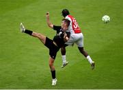 20 July 2025; Craig Walsh of UCC in action against Al-Amin Kazeem of St Patrick's Athletic during the Sports Direct Men’s FAI Cup second round match between St. Patrick’s Athletic and UCC at Richmond Park in Dublin. Photo by Michael P Ryan/Sportsfile