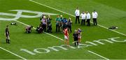 20 July 2025; Referee Liam Gordon does the toss with team captains Robert Downey of Cork and Ronan Maher of Tipperary ahead of the GAA Hurling All-Ireland Senior Championship final match between Cork and Tipperary at Croke Park in Dublin. Photo by Daire Brennan/Sportsfile