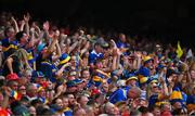 20 July 2025; Tipperary supporters celebrate a score during the GAA Hurling All-Ireland Senior Championship final match between Cork and Tipperary at Croke Park in Dublin. Photo by Ray McManus/Sportsfile