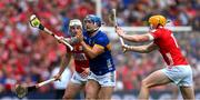 20 July 2025; Willie Connors of Tipperary is tackled by Shane Barrett and Brian Hayes of Cork during the GAA Hurling All-Ireland Senior Championship final match between Cork and Tipperary at Croke Park in Dublin. Photo by Ray McManus/Sportsfile