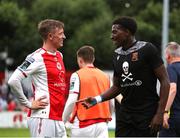 20 July 2025; Chris Forrester of St Patrick's Athletic, left, with Joshua Suleiman of UCC after the Sports Direct Men’s FAI Cup second round match between St. Patrick’s Athletic and UCC at Richmond Park in Dublin. Photo by Michael P Ryan/Sportsfile