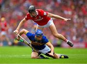 20 July 2025; John McGrath of Tipperary is tackled by Eoin Downey of Cork during the GAA Hurling All-Ireland Senior Championship final match between Cork and Tipperary at Croke Park in Dublin. Photo by Ray McManus/Sportsfile