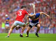 20 July 2025; John McGrath of Tipperary is tackled by Eoin Downey of Cork during the GAA Hurling All-Ireland Senior Championship final match between Cork and Tipperary at Croke Park in Dublin. Photo by Ray McManus/Sportsfile