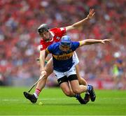 20 July 2025; John McGrath of Tipperary is tackled by Eoin Downey of Cork during the GAA Hurling All-Ireland Senior Championship final match between Cork and Tipperary at Croke Park in Dublin. Photo by Ray McManus/Sportsfile