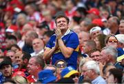 20 July 2025; A Tipperary supporter celebrates during the GAA Hurling All-Ireland Senior Championship final match between Cork and Tipperary at Croke Park in Dublin. Photo by Stephen McCarthy/Sportsfile