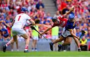 20 July 2025; John McGrath of Tipperary is fouled for a penalty by Eoin Downey of Cork, second from left, before Downey was sent off for a second yellow card during the GAA Hurling All-Ireland Senior Championship final match between Cork and Tipperary at Croke Park in Dublin. Photo by Piaras Ó Mídheach/Sportsfile