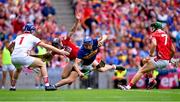 20 July 2025; John McGrath of Tipperary is fouled for a penalty by Eoin Downey of Cork, second from left, before Downey was sent off for a second yellow card during the GAA Hurling All-Ireland Senior Championship final match between Cork and Tipperary at Croke Park in Dublin. Photo by Piaras Ó Mídheach/Sportsfile