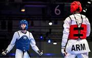 21 July 2025; Ryan Doyle, from Balleycullen in Dublin, representing Technological University Dublin and Ireland, in action against Armen Danielyan, representing Armenian State Institute of Physical Culture and Armenia, during the men's 74kg match on day five of the FISU World University Games 2025 at Messe Essen Halle in Essen, Germany. Photo by Shauna Clinton/Sportsfile