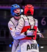 21 July 2025; Ryan Doyle, from Balleycullen in Dublin, representing Technological University Dublin and Ireland, in action against Armen Danielyan, representing Armenian State Institute of Physical Culture and Armenia, during the men's 74kg match on day five of the FISU World University Games 2025 at Messe Essen Halle in Essen, Germany. Photo by Shauna Clinton/Sportsfile