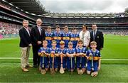 20 July 2025; Camogie Association president Brian Molloy, Uachtarán Chumann Lúthchleas Gael Jarlath Burns, INTO President Anne Horan, and President of Cumann na mBunscol Gary Farrell, with the Tipperary team, back row, left to right, Jamie Elmer, St Brendan's NS, St Mullins, Carlow, Cian Harrington, St Mary's SNS, Blessington, Wicklow, Joshua Ryan, Scoil Dean Cussen, Bruff, Limerick, Fionnáin Ó Dubhthaigh, Gaelscoil Thaobh na Coille, An Chéim, Baile Átha Cliath, front row, left to right, Hugo O'Neill, Scoil Chéile Chríost NS, Rathmore, Kildare, Rossa McAleenan, Bunscoil Bheanna Boirche, Castlewellan, Down, Archie McGarry, St Patrick's PS, Loughuile, Antrim, Darragh O'Callaghan, St Joseph's PS, Bessbrook, Armagh, James Donnelly, St Mary's NS, Stranorlar, Donegal, Cillian Spillane, St Mary's BNS, Rathfarnham, Dublin, before the GAA INTO Cumann na mBunscol Respect Exhibition Go Games at the GAA Hurling All-Ireland Senior Championship final match between Cork and Tipperary at Croke Park in Dublin. Photo by Daire Brennan/Sportsfile