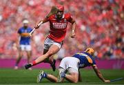 20 July 2025; Brian Hayes of Cork hops over Tipperary's Conor Stakelum during the GAA Hurling All-Ireland Senior Championship final match between Cork and Tipperary at Croke Park in Dublin. Photo by Seb Daly/Sportsfile