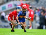 20 July 2025; Eimear Morgán, St Columba's PS, Coleraine, Derry, representing Tipperary, in action against Molly Dooling, St Michael's NS, Ballyduff Upper, Waterford, representing Cork, during the GAA INTO Cumann na mBunscol Respect Exhibition Go Games at the GAA Hurling All-Ireland Senior Championship final match between Cork and Tipperary at Croke Park in Dublin. Photo by Ray McManus/Sportsfile
