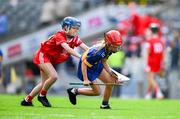 20 July 2025; Eimear M'orgán, St Columba's PS, Coleraine, Derry, representing Tipperary, in action against Molly Dooling, St Michael's NS, Ballyduff Upper, Waterford, representing Cork, during the GAA INTO Cumann na mBunscol Respect Exhibition Go Games at the GAA Hurling All-Ireland Senior Championship final match between Cork and Tipperary at Croke Park in Dublin. Photo by Ray McManus/Sportsfile