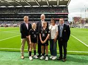 20 July 2025; Camogie Association president Brian Molloy, Uachtarán Chumann Lúthchleas Gael Jarlath Burns, INTO President Anne Horan, and President of Cumann na mBunscol Gary Farrell, with the referees Amelia Ní Chonaill, Gaelscoil an Ghort Álainn, Gort Álainn, Corcaigh, and Sean Holland, Scoil Mhuire, Ballyhooly, Cork, before the GAA INTO Cumann na mBunscol Respect Exhibition Go Games at the GAA Hurling All-Ireland Senior Championship final match between Cork and Tipperary at Croke Park in Dublin. Photo by Daire Brennan/Sportsfile
