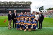 20 July 2025; Camogie Association president Brian Molloy, Uachtarán Chumann Lúthchleas Gael Jarlath Burns, INTO President Anne Horan, and President of Cumann na mBunscol Gary Farrell, with the Tipperary team, back row, left to right, Aoibhínn Wilson, Gaelscoil Eoghain, Cookstown, Tyrone, Fainche Mac Seáin, St Felim's NS, Ballinagh, Cavan, Jill McDonnell, St Mary's NS, Mullingar, Westmeath,  Paige Dwyer, Queen of the Universe NS, Bagenalstown, Carlow, Saoirse Ní Bhroin, Gaelscoil Bharra, Cabrach, Ath Cliath, front row, left to right, Megan Moloney, Scoil Eoin Naofa, Roscrea, Tipperary, Lorianne Keenan, St Partick's NS, Castleblayney, Monaghan, Fianna O'Reilly, St Ninnidh's PS, Derrylin, Fermanagh, Eimear M'orgán, St Columba's PS, Coleraine, Derry, Holly Dean, Divine Word NS, Rathfarnham, Dublin, before the GAA INTO Cumann na mBunscol Respect Exhibition Go Games at the GAA Hurling All-Ireland Senior Championship final match between Cork and Tipperary at Croke Park in Dublin. Photo by Daire Brennan/Sportsfile