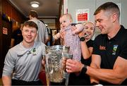21 July 2025; Captain of All-Ireland Hurling Champions Tipperary, Ronan Maher, right, and teammate Jake Morris, left, with Iseult Shelly, aged 10 months from Blackrock, Dublin, and her mother Martha McGann and the Liam MacCarthy Cup at Children's Health Ireland, Crumlin in Dublin after winning The Liam MacCarthy Cup at Croke Park on Sunday. Photo by Sam Barnes/Sportsfile